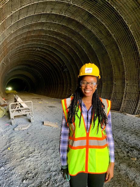 Symone Howard in front of tunnel project